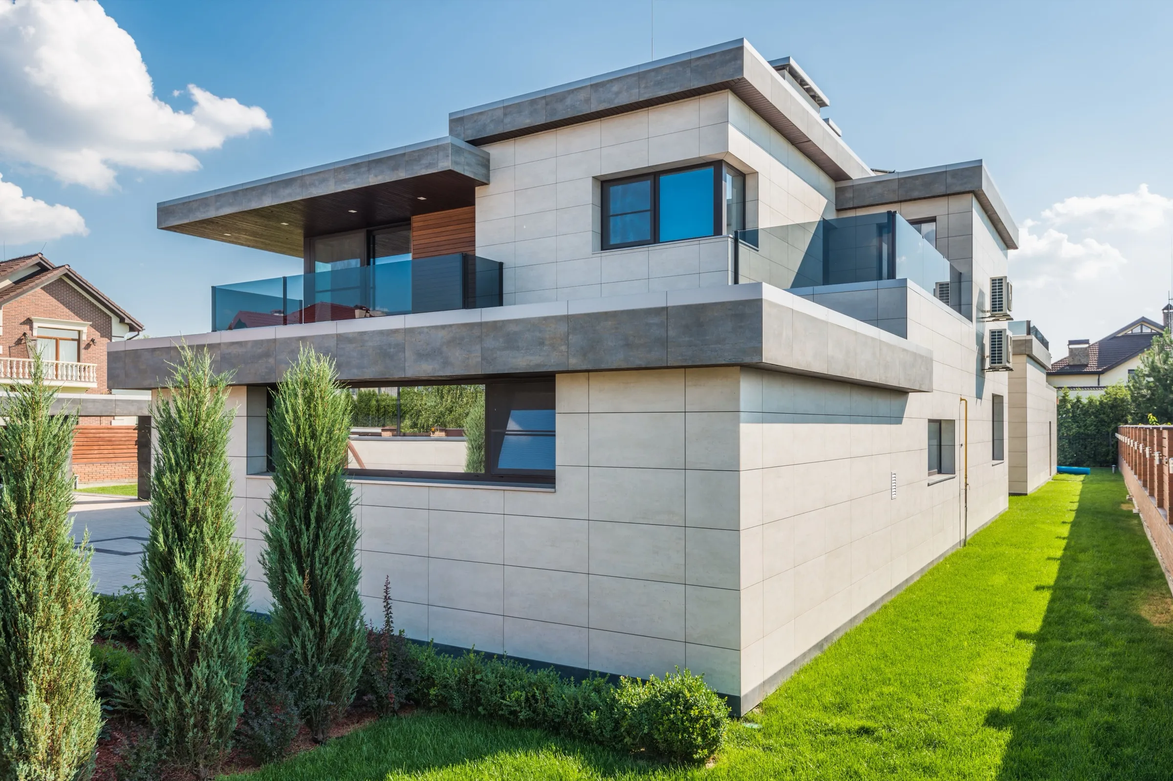 Contemporary house with stone cladding and a cypress garden