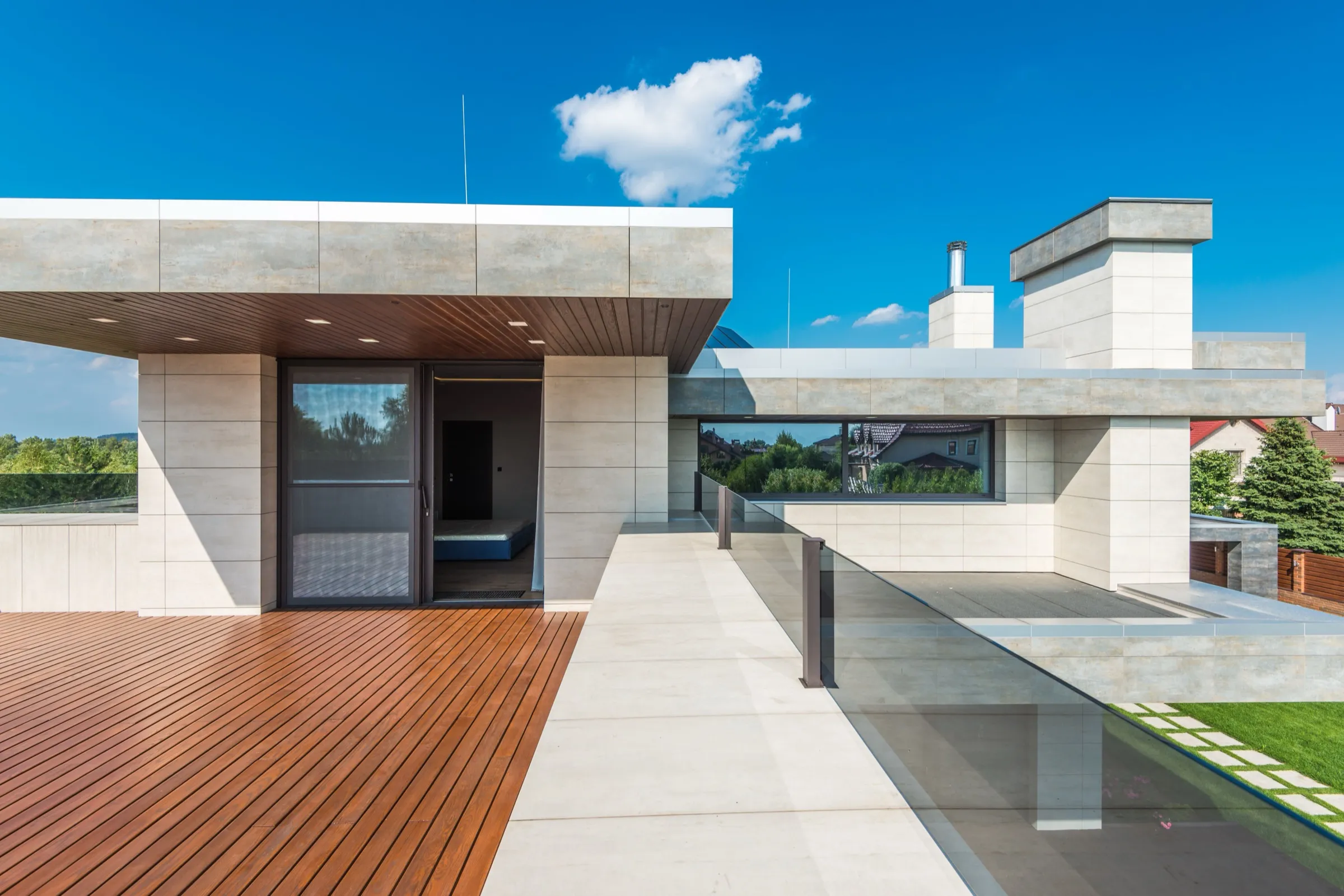 Villa terrace with timber deck and glass railing